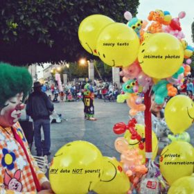 Picture of a clown with balloons with text on them that relate to the Bezos hacking events